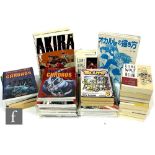 A collection of books and graphic novels, mostly manga, to include Dark Horse Comics Lone Wolf and