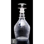 An early 19th Century Irish clear crystal decanter, circa 1805, of ovoid form with alternating