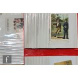 A collection of Edwardian humorous, comical and greetings postcards contained in two flip albums. (