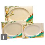 A Clarice Cliff Biarritz graduated set of meat plates circa 1933, hand painted to the shoulder in