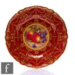 A Royal Worcester hand painted cabinet plate decorated by Freeman with hand painted fruits and