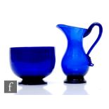 An early 19th Century Bristol Blue jug, circa 1800, of footed ovoid form with flared neck and