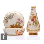 A Royal Worcester blush ivory shape 1294 powder box and cover decorated with flowers and moulded