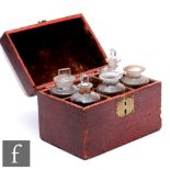 A 19th Century red painted apothecary travelling casket, brass handle, the hinged to opening to