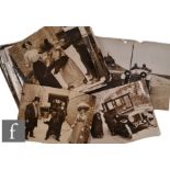 A large collection of Edwardian press release black and white photographs, to include social