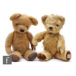 Two 1950s Chad Valley teddy bears, the first with golden mohair and velveteen paw pads, label to