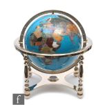 A late 20th Century table globe with agate set countries on a blue sea and brass frame.