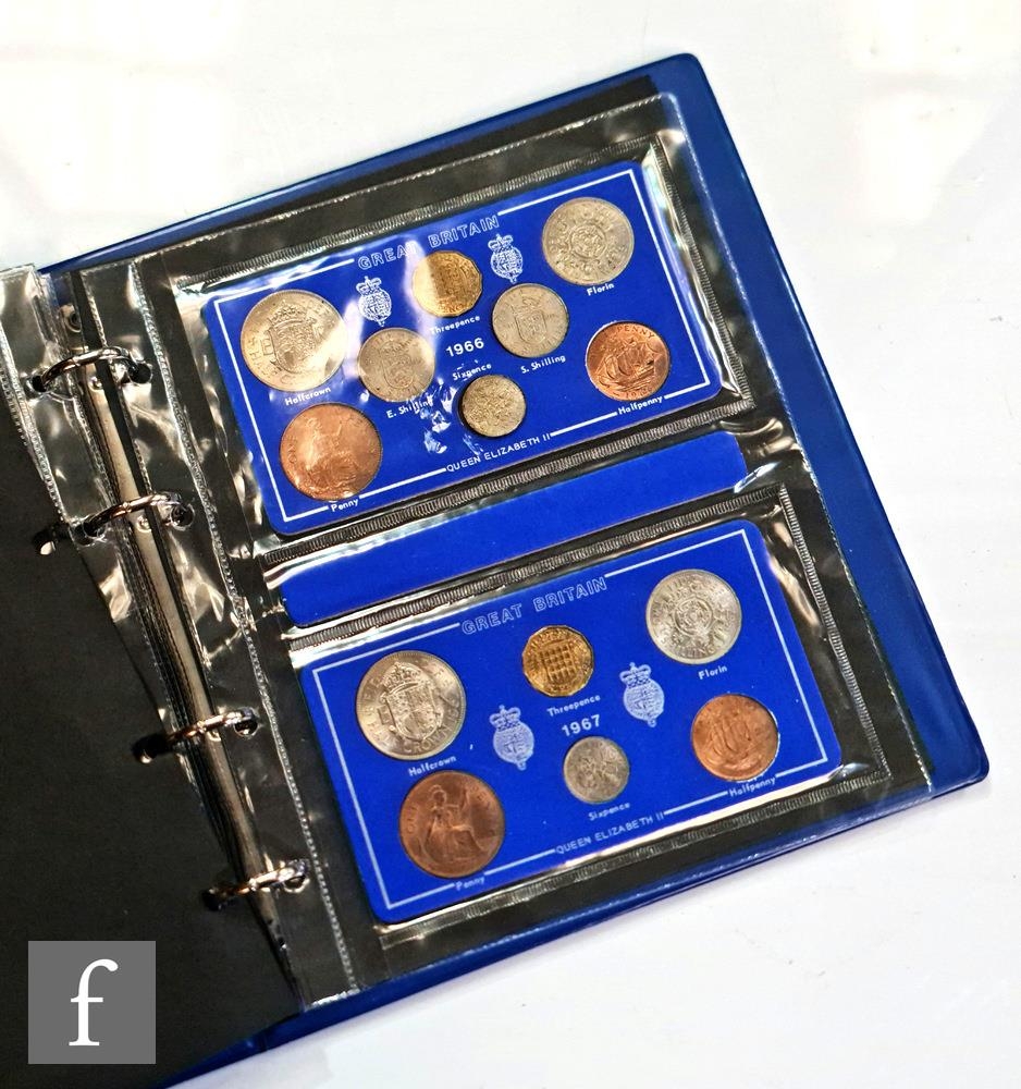 An album of Elizabeth II coin sets 1953-1967.