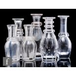 A group of six early 19th Century clear crystal water/spirit bottles, circa 1810, of ovoid form with