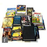 A collection of assorted books, mostly reference books, relating to the Marvel universe, DC,