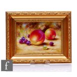 A framed Royal Worcester Fallen Fruits hand painted plaque by S. Wood by a peach, apple, cherries