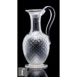A Stourbridge, possibly Richardsons, clear crystal claret jug, of footed ovoid form with tall collar