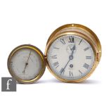 A Smith's Astral brass bulkhead clock, width 18cm, and a brass circular aneroid barometer. (2)