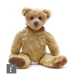 An early 20th Century British teddy bear, 1920s, possibly WJ Terry, golden mohair, large reverse