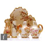 Five pieces of Royal Worcester blush ivory comprising a pair of 1094 flatback jugs decorated with