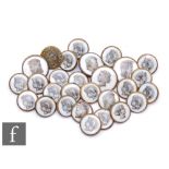 A collection of 19th Century brass backed buttons in two sizes inset with a white enamel and each