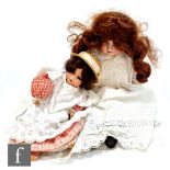 Two Armand Marseille bisque head dolls, a shoulder head doll with sleeping brown eyes, open mouth