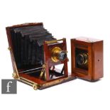 A Victorian mahogany and brass mounted half plate camera 'The Compactum' Patent, maroon bellows, and