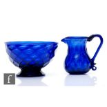 An early 19th Century Bristol blue glass jug, circa 1800, of squat ovoid form and flared neck with