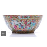 A late 19th Century Chinese Canton famille rose punch bowl, the circular bowl decorated with a