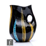 A mid 20th Century Italian stylised jug of irregular form decorated with yellow, blue, green and