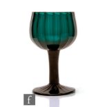 An 18th Century Bristol Green wine glass, circa 1770, the cup bowl with vertical ribbed moulding