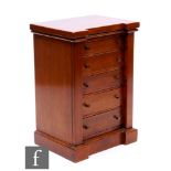 A 20th Century mahogany inverted breakfront miniature Wellington style chest of five graduated