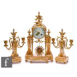 An early 20th Century French gilt metal mounted clock garniture, eight day striking movement figured