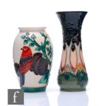 Two small Moorcroft Pottery vases, one decorated in the Cluny pattern and one in the Plum Tree and