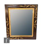 A 20th Century rectangular wall mirror decorated with Art Nouveau applied gilt floral motifs over