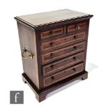 A late 19th to early 20th Century apprentice miniature mahogany and satinwood crossbanded chest of