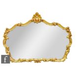 A late 20th Century gilt wall mirror in cartouche frame and surmounted with a shell, height 89cm x