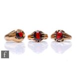 Three 9ct gentleman's single stone garnet rings, total weight 17.5g, all claw set to reeded