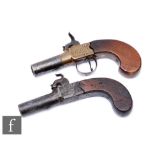 A 19th Century percussion muff pistol, 5cm twist off barrel, together with a similar muff pistol 4.