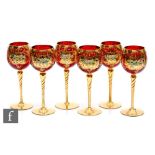 A set of six Bohemian wine glasses, the ovoid bowl decorated with relief enamel floral decoration