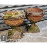 A pair of late 19th to early 20th Century terracotta garden terrace urns, with rope twist style