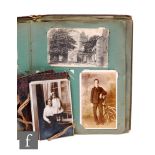 An Edwardian postcard album, subjects including social history, glamour and comical, with a small