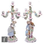 A pair of late 19th Century/early 20th continental porcelain Sitzendorf candelabrum, the central