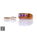 An 18ct diamond solitaire ring, weight 1.8g, with a 14ct three stone amethyst ring, weight 4g. (2)