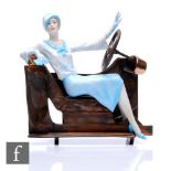 An Albany Fine China lady in the Art Deco style, dressed in blue and sat in a cross section of a