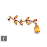 A 9ct hallmarked citrine and diamond pendant, seven marquise and pear cut claw set citrines detailed