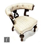 A Victorian walnut horse shoe back library style easy chair, upholstered in cream floral tapestry on