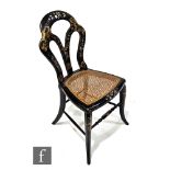 A mid Victorian Japanned lacquered cane seat bedroom chair, inlaid with mother of pearl and detailed