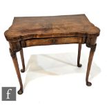 A 19th Century George I style walnut and feather banded fold over tea table fitted