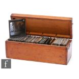 A wooden case of early magic lantern slides, various subjects. (qty)