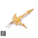 A 9ct hallmarked spray brooch modelled as a fern leaf and highlighted with fourteen cultured pearls,