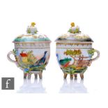 A pair of Naples custard cups and covers each decorated with various birds and their young, the