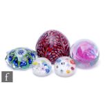 A small group of 20th Century paperweights to include an Italian example with external millefiori