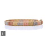 A 9ct hallmarked tri-coloured hinged stiff bangle, weight 14.5g, terminating in tongue and box snap.