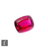 A loose cut and polished cushioned rectangular rubellite stone 13.5mm x 10.5mm x 6.5mm, weight 6.